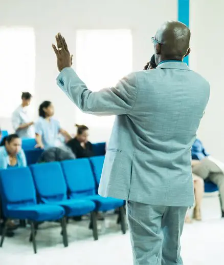 A man in a suit is standing up